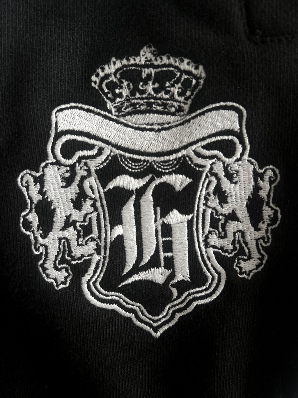 black “hidden tears” zip-up